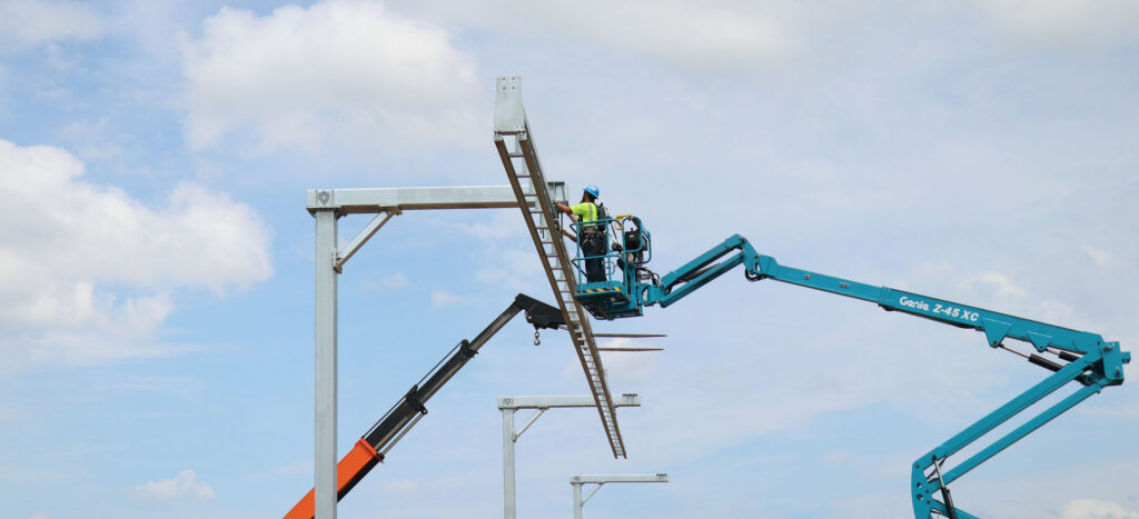 safety rail company setting up column overhead fall protection
