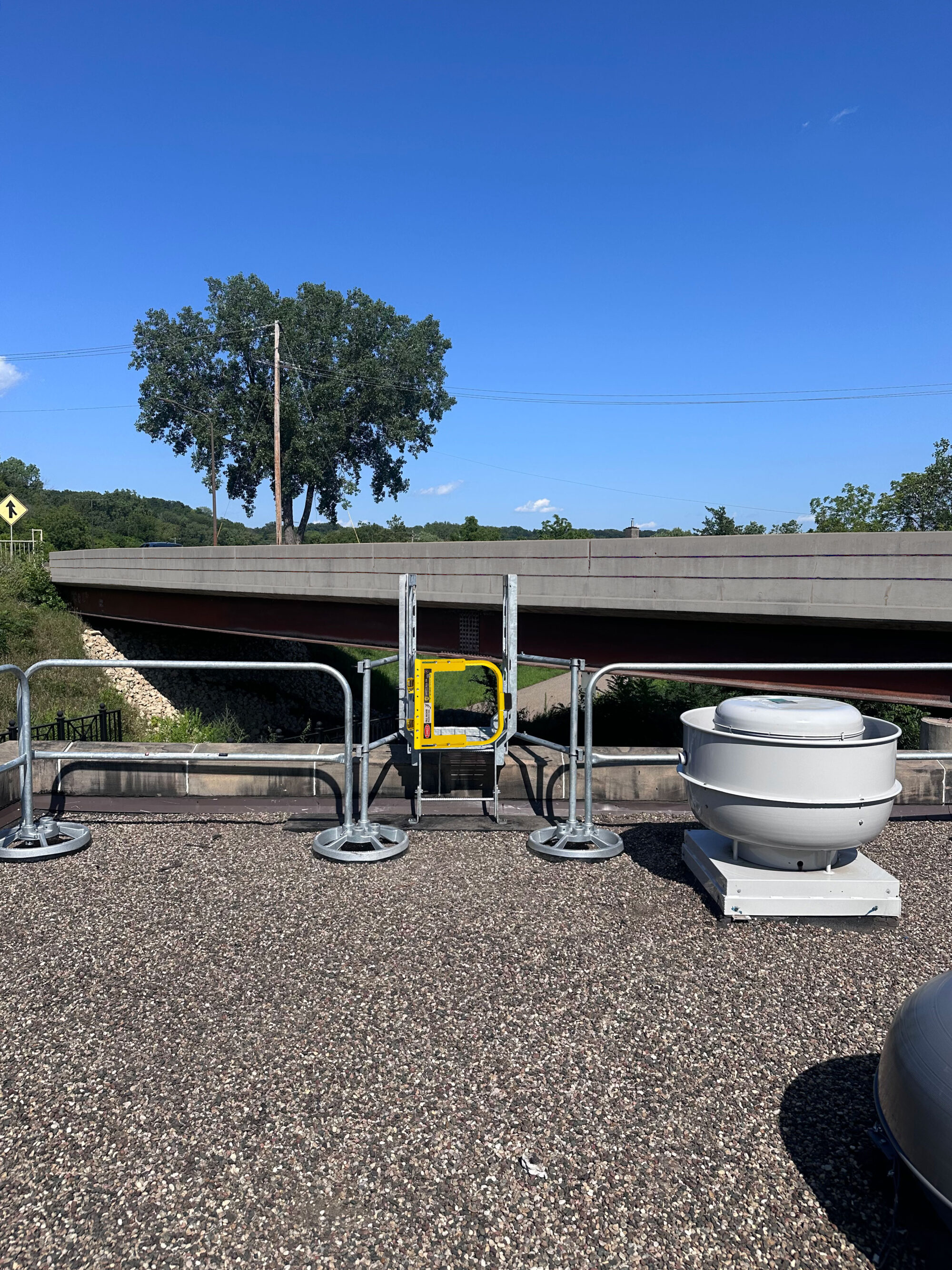 self-closing gate with SRC360 mobile rail on exterior rooftop