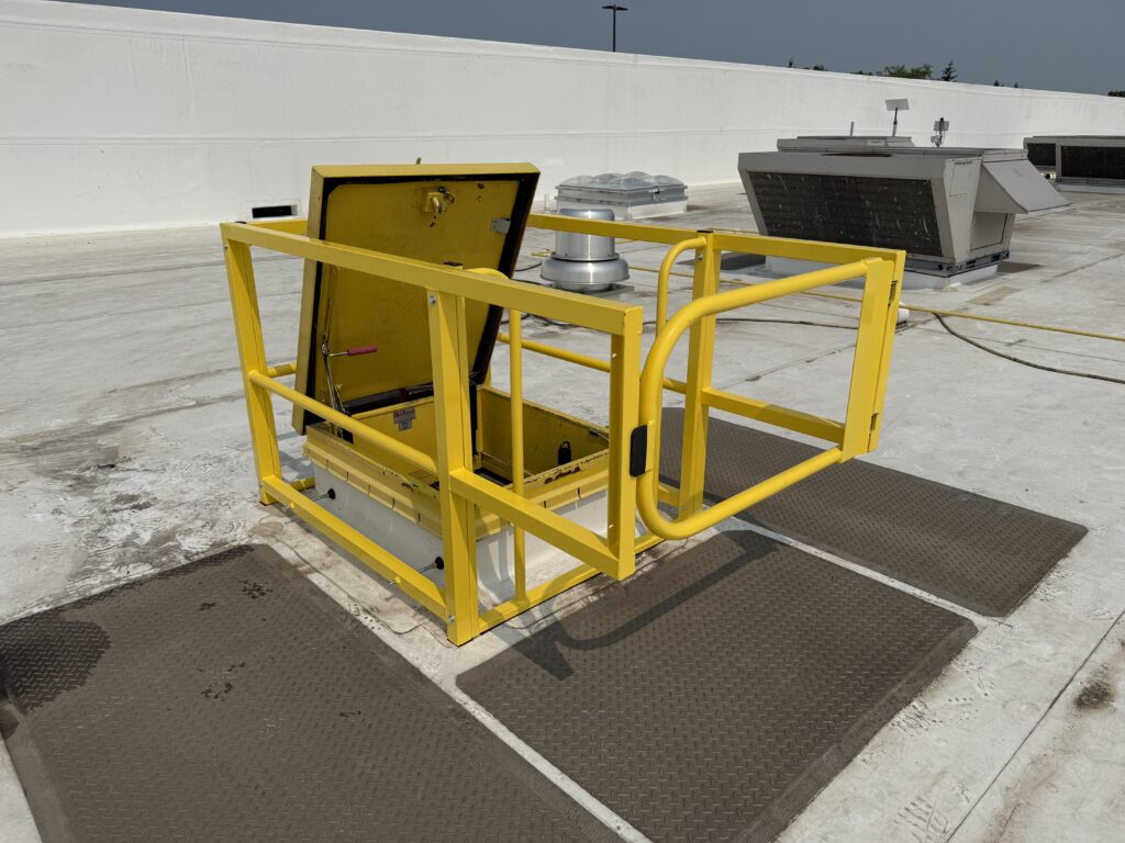 yellow hatchguard protecting rooftop access hatch on a roof
