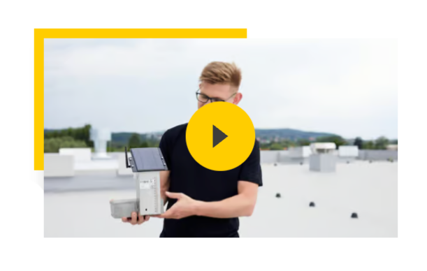 Video thumbnail showing a man holding a solar-powered roof sensor with a yellow play button overlay.